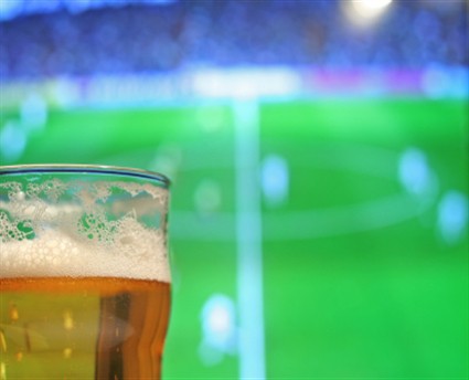 Beer-in-foreground-football-